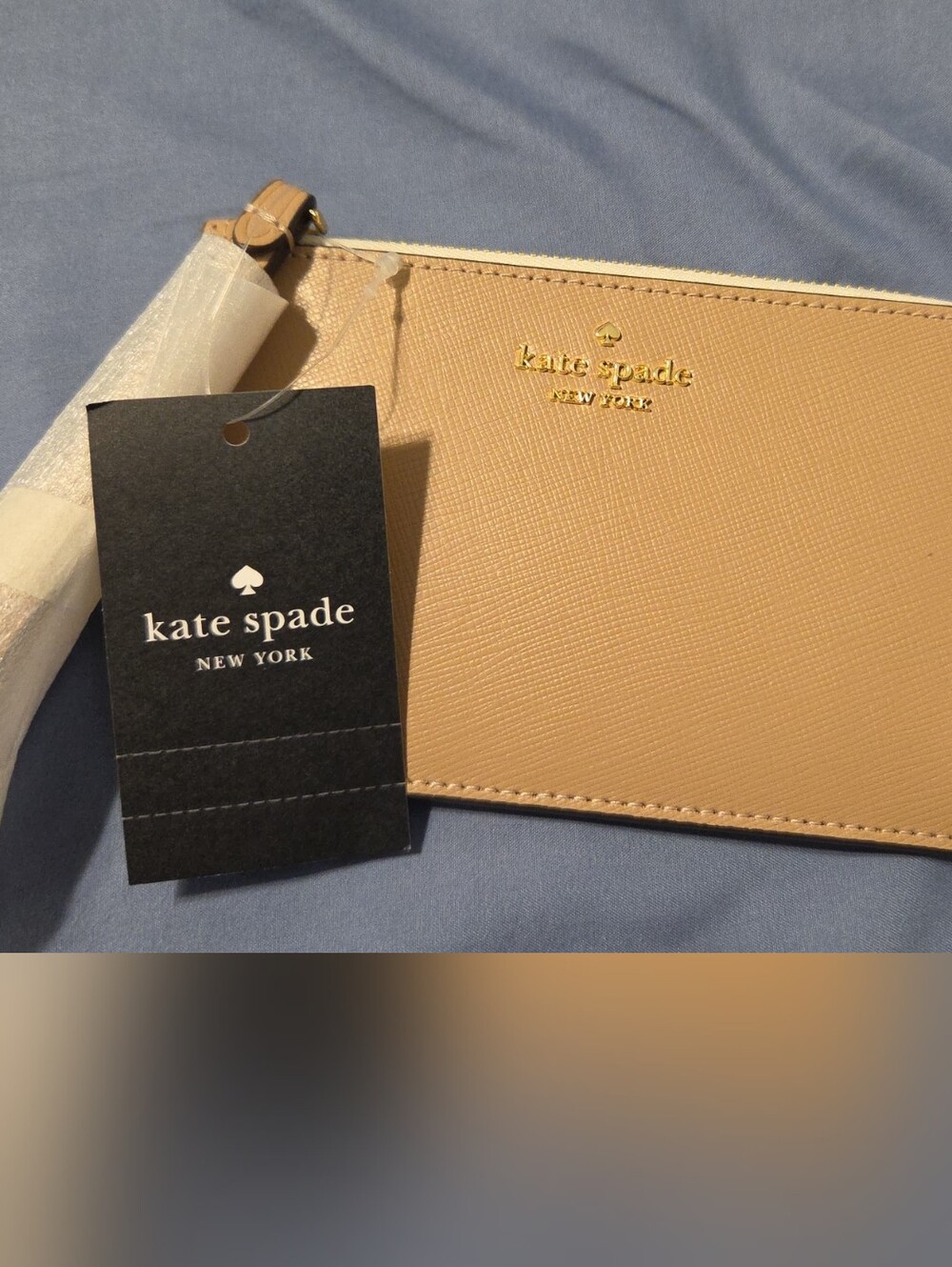 kate spade beige zip wristlet with gold logo
